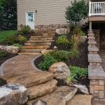 natural stone stairs with landscaping