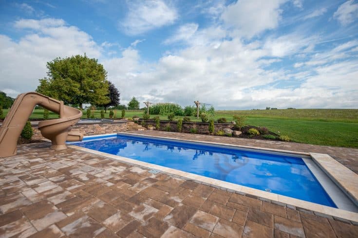 Fiberglass Swimming Pool with Outdoor Living Space complete with Fire pit and Hot tub in Bedford, PA